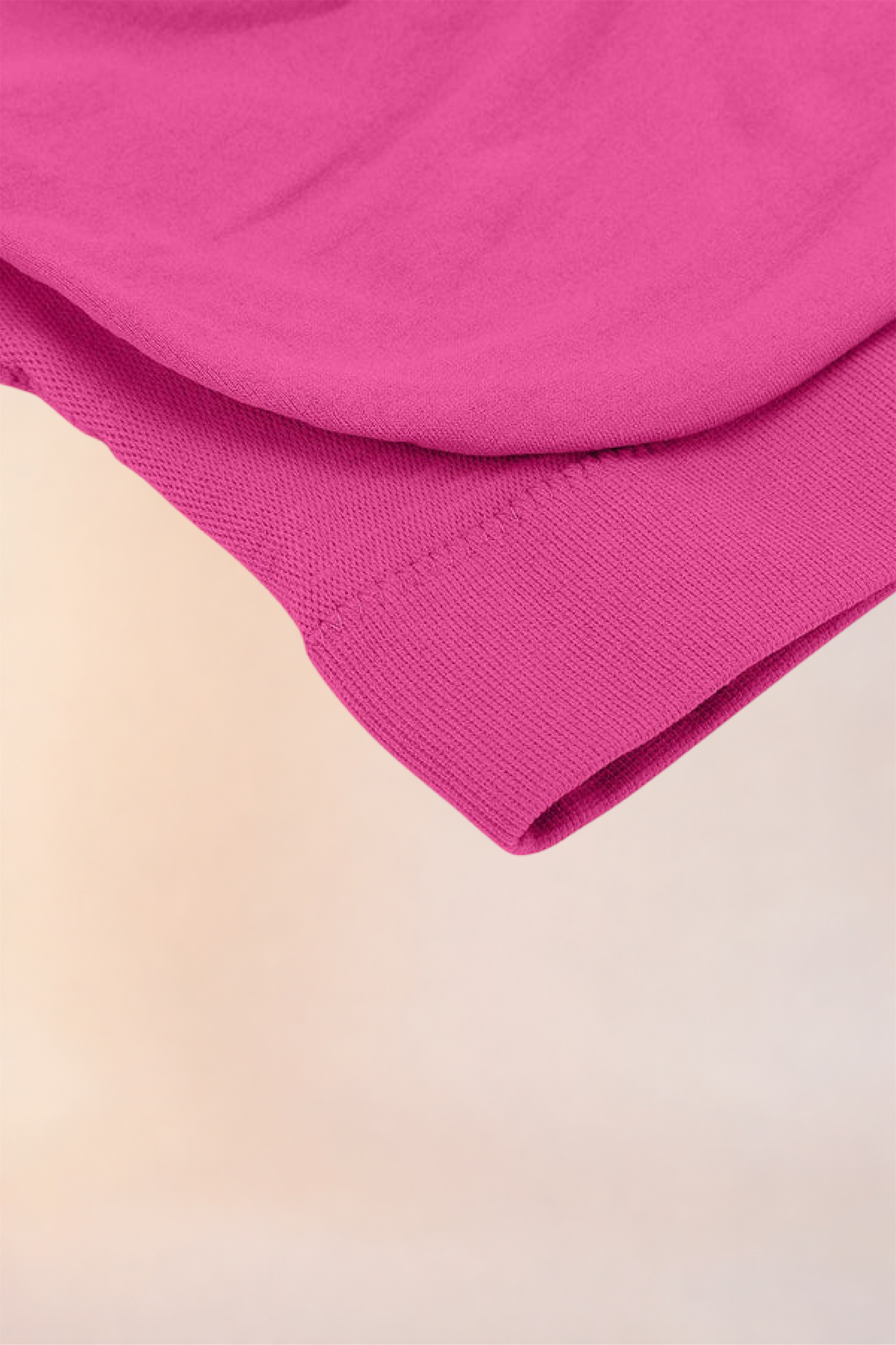 Close-up of the folded hem and underband on the Skinzform Scoop Bralette in Rose