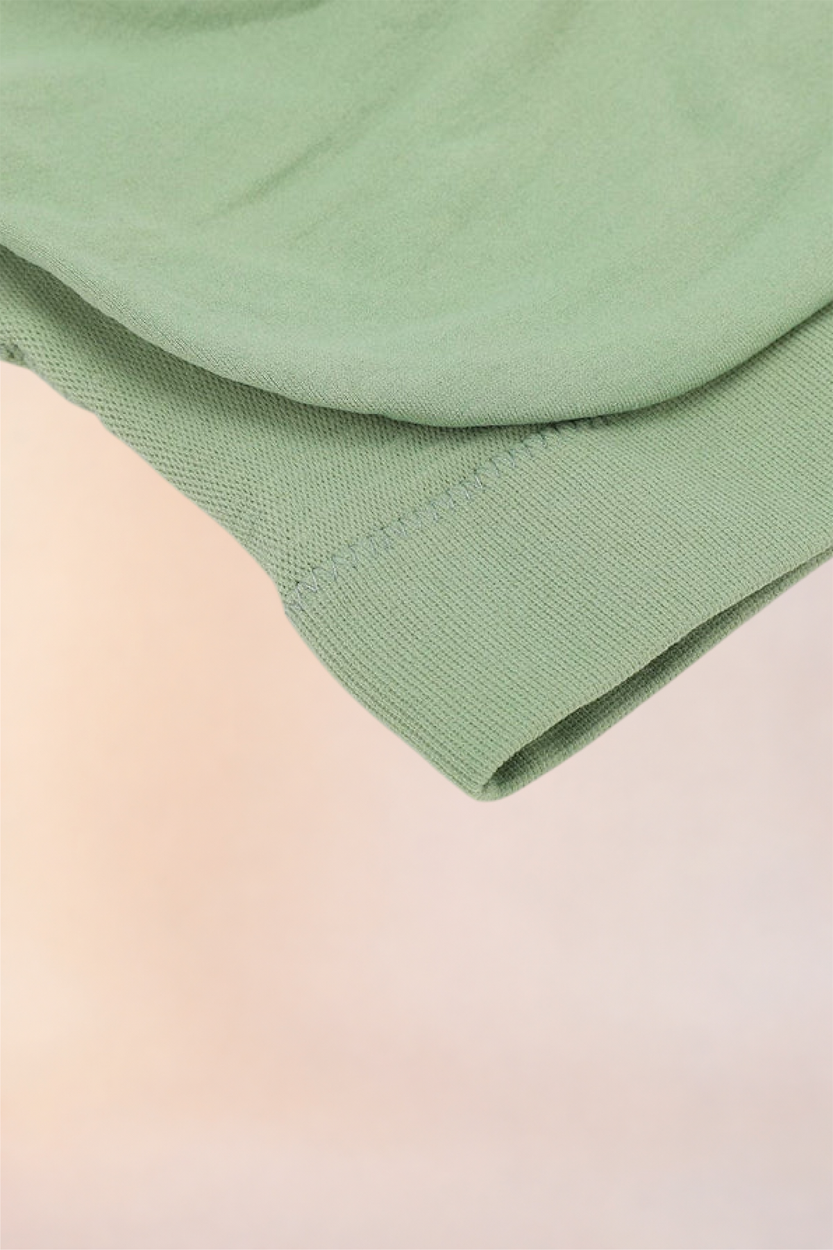 Close-up of the folded hem and underband on the Skinzform Scoop Bralette in Sage