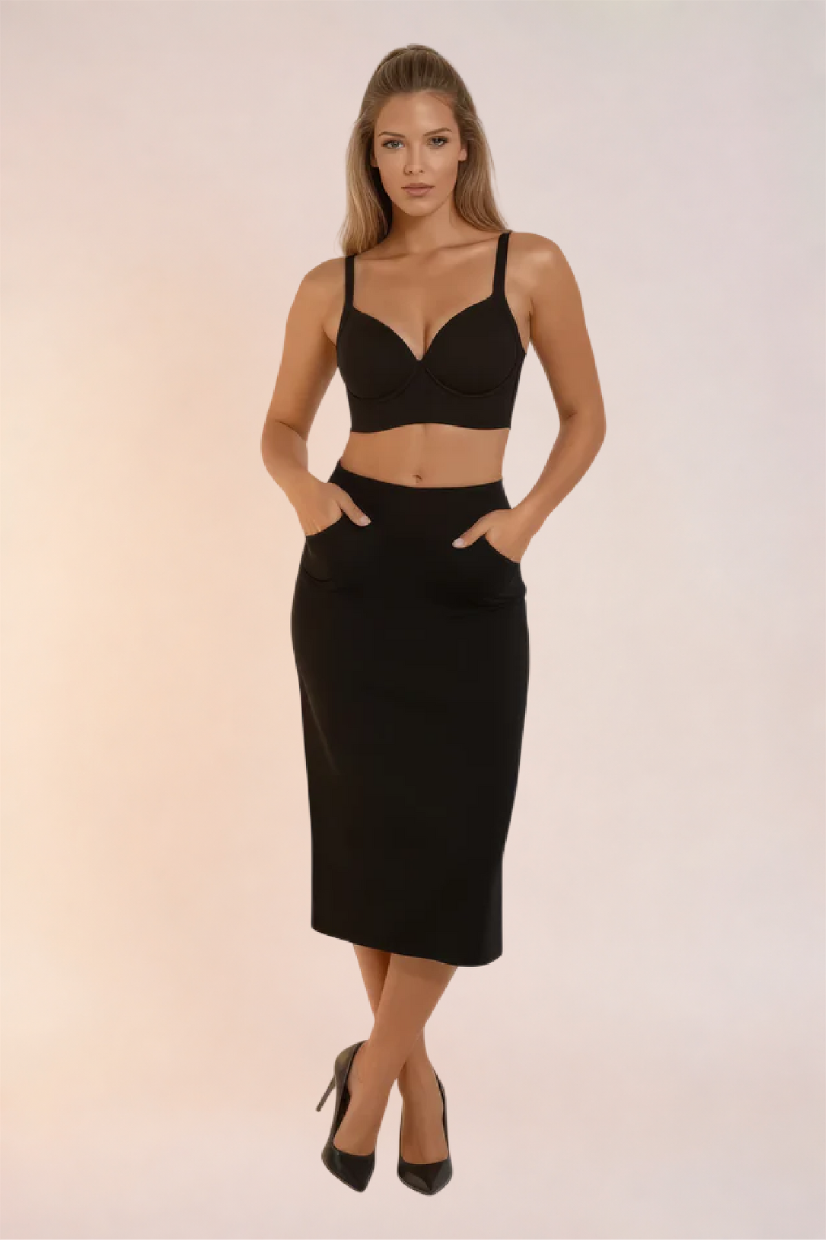 Skinzform Sculpt Bra in Noir styled with a black pencil skirt, full-length front view