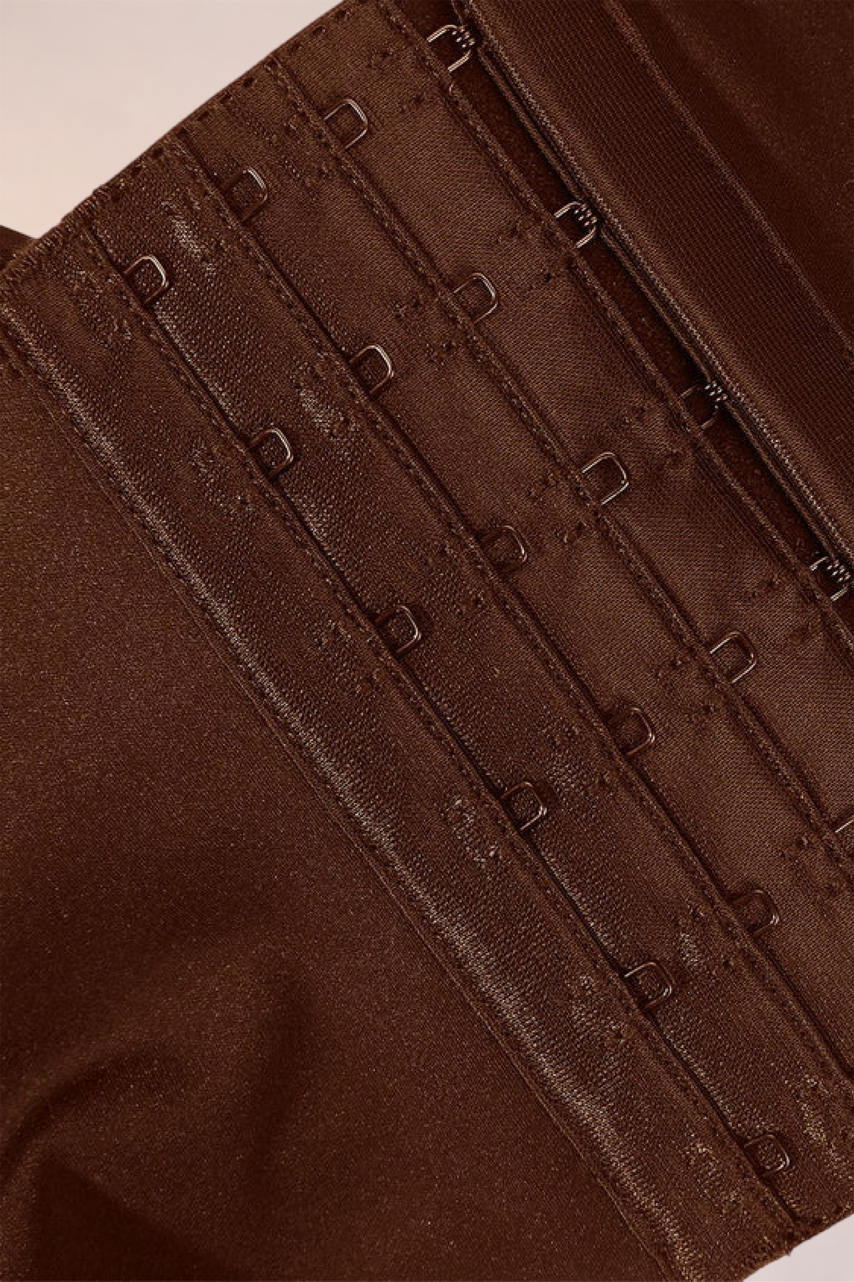 Close-up of the three-row hook-and-eye fastening on the Skinzform Sculpt Bra – Cacao
