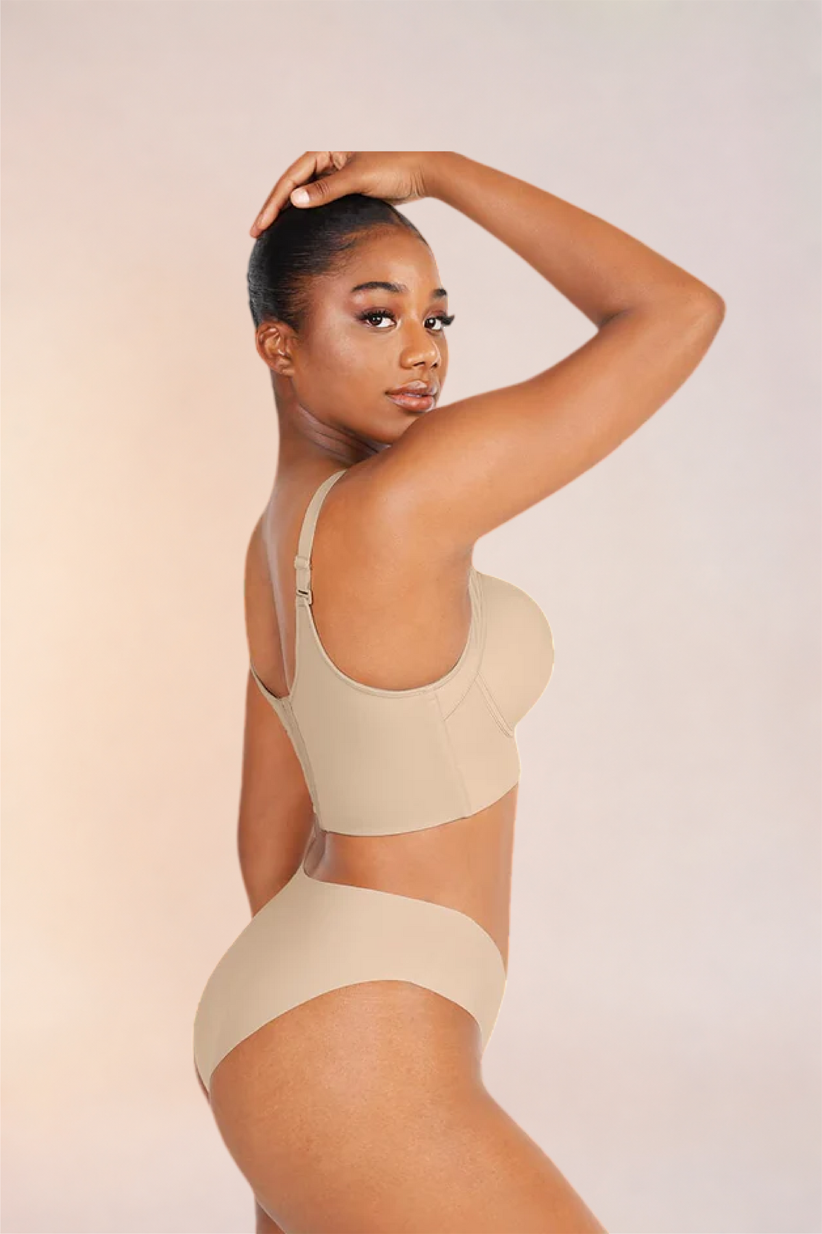 Skinzform Sculpt Bra – Nude worn with matching briefs, side view with a hand at the head