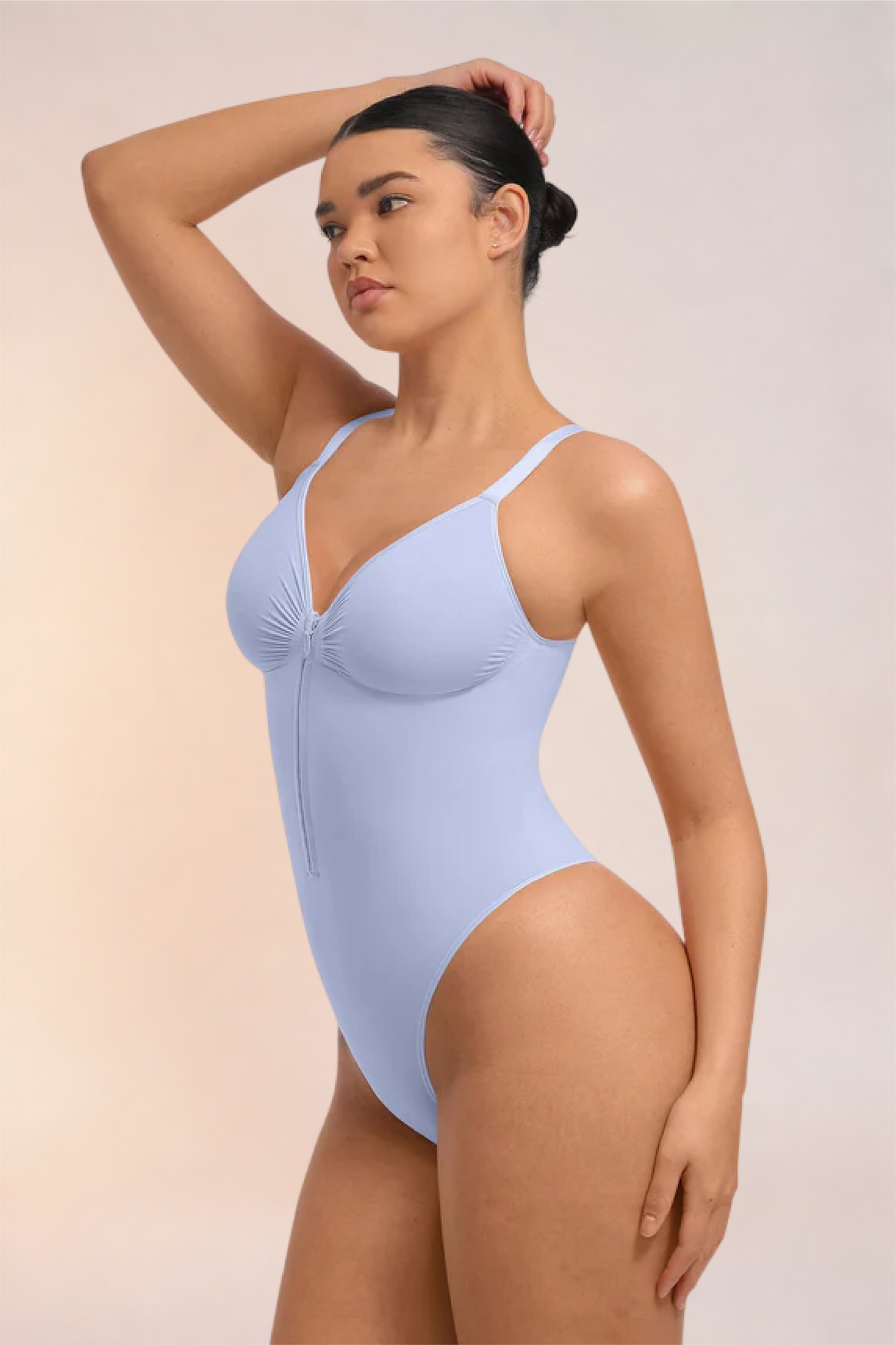 Skinzform Séjour Bodysuit in Lavender, side view on the model