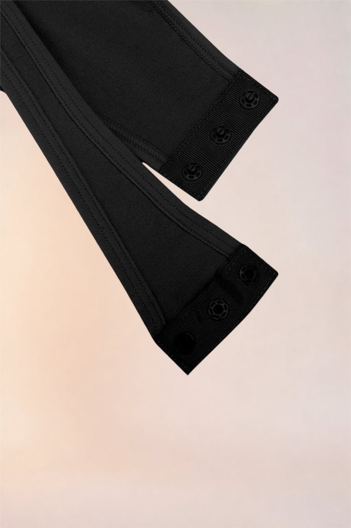 Close-up of the gusset snap fastening on the Skinzform Séjour Bodysuit in Noir