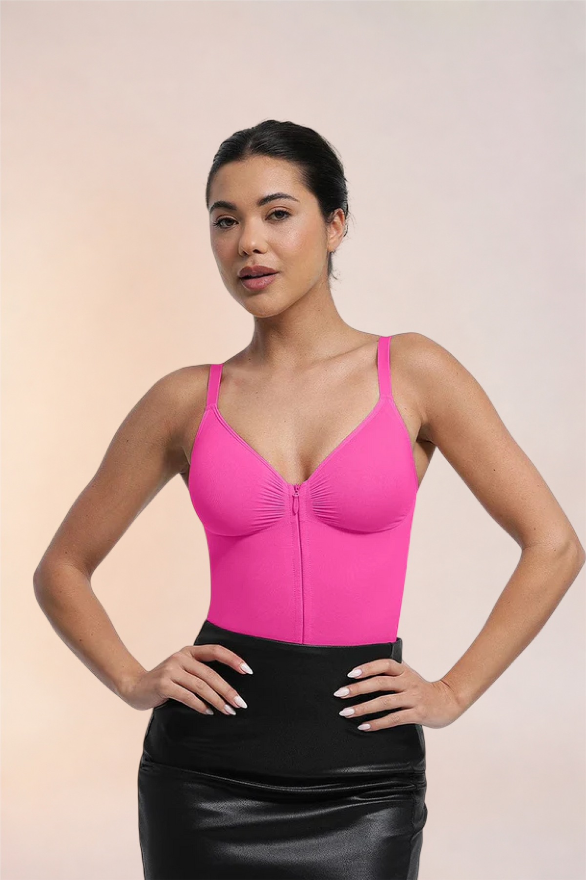 Skinzform Séjour Bodysuit in Rose styled with a black leather skirt, front view