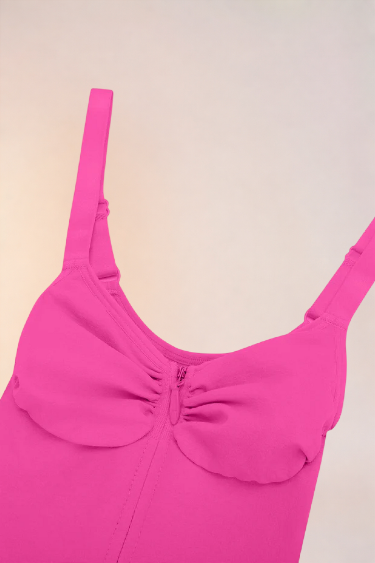 Close-up of the moulded cups and ruched centre on the Skinzform Séjour Bodysuit in Rose