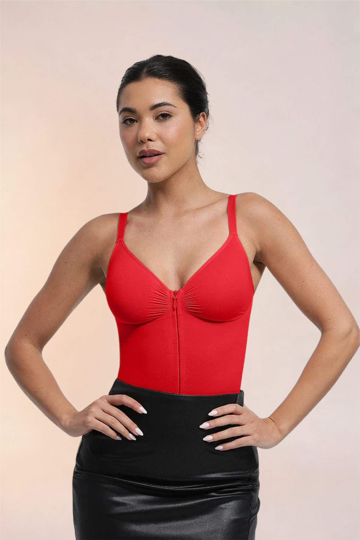 Skinzform Séjour Bodysuit in Rouge styled with a black leather skirt, front view