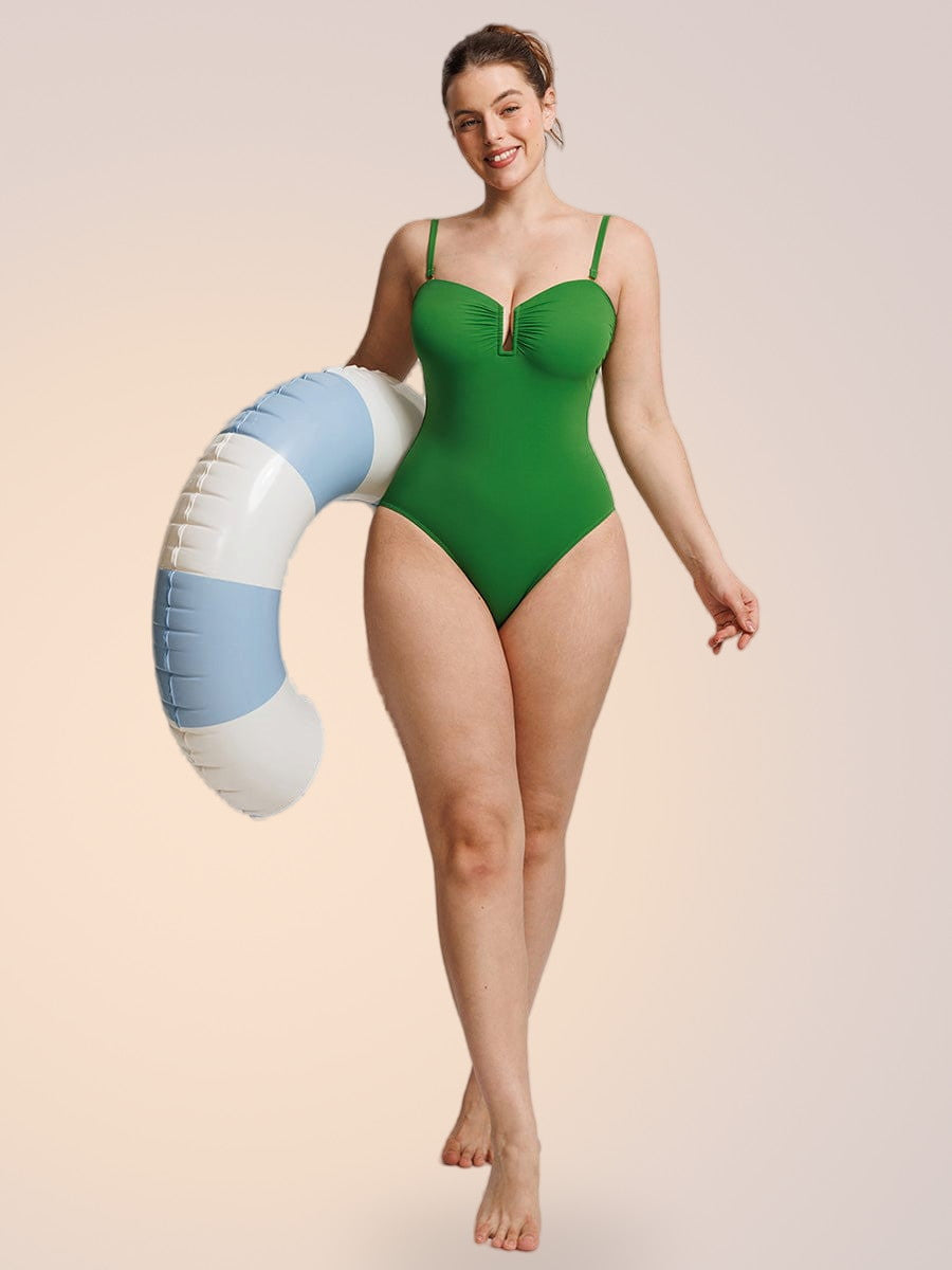 Skinzform Soleil Swimsuit in Forest with straps attached - model walking with a pool ring