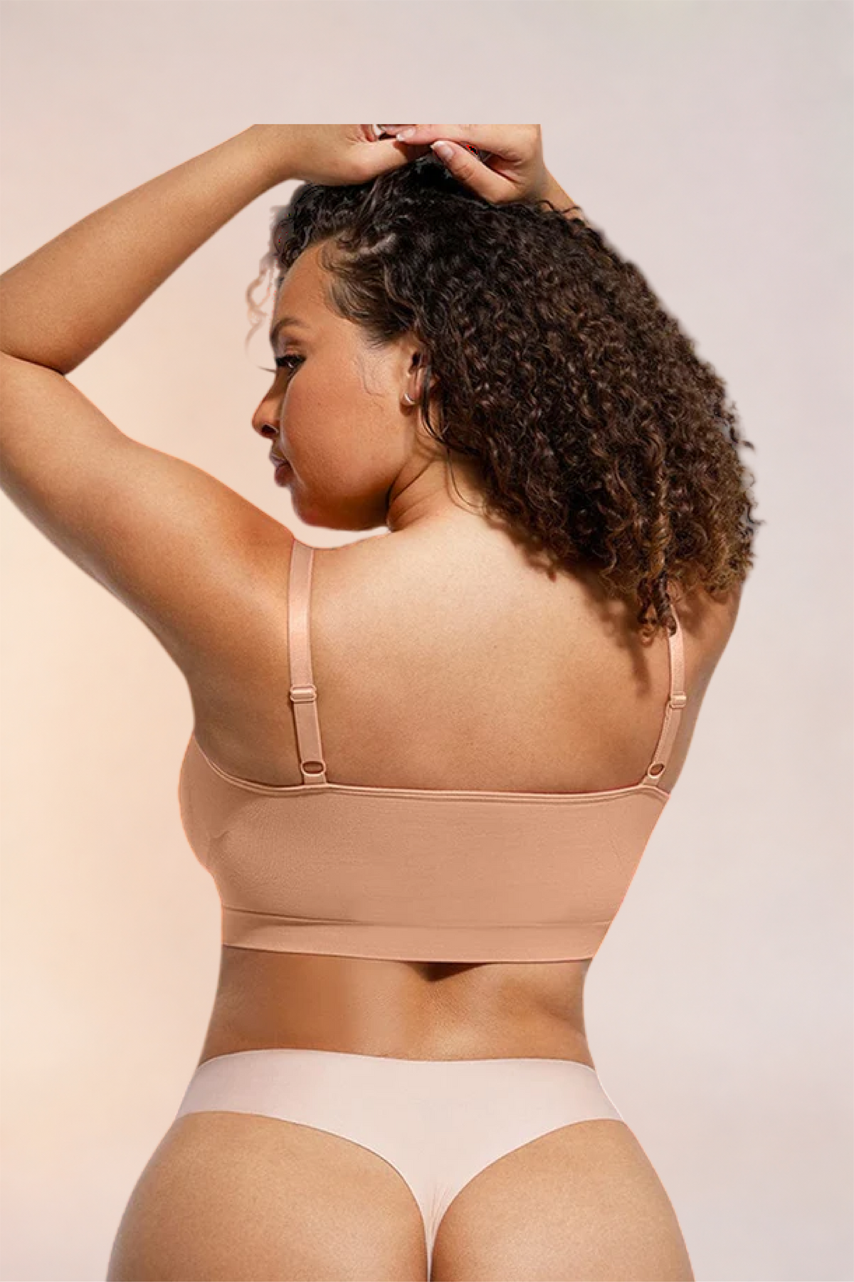 Skinzform Soutien Bra in Beige, back view with arms raised