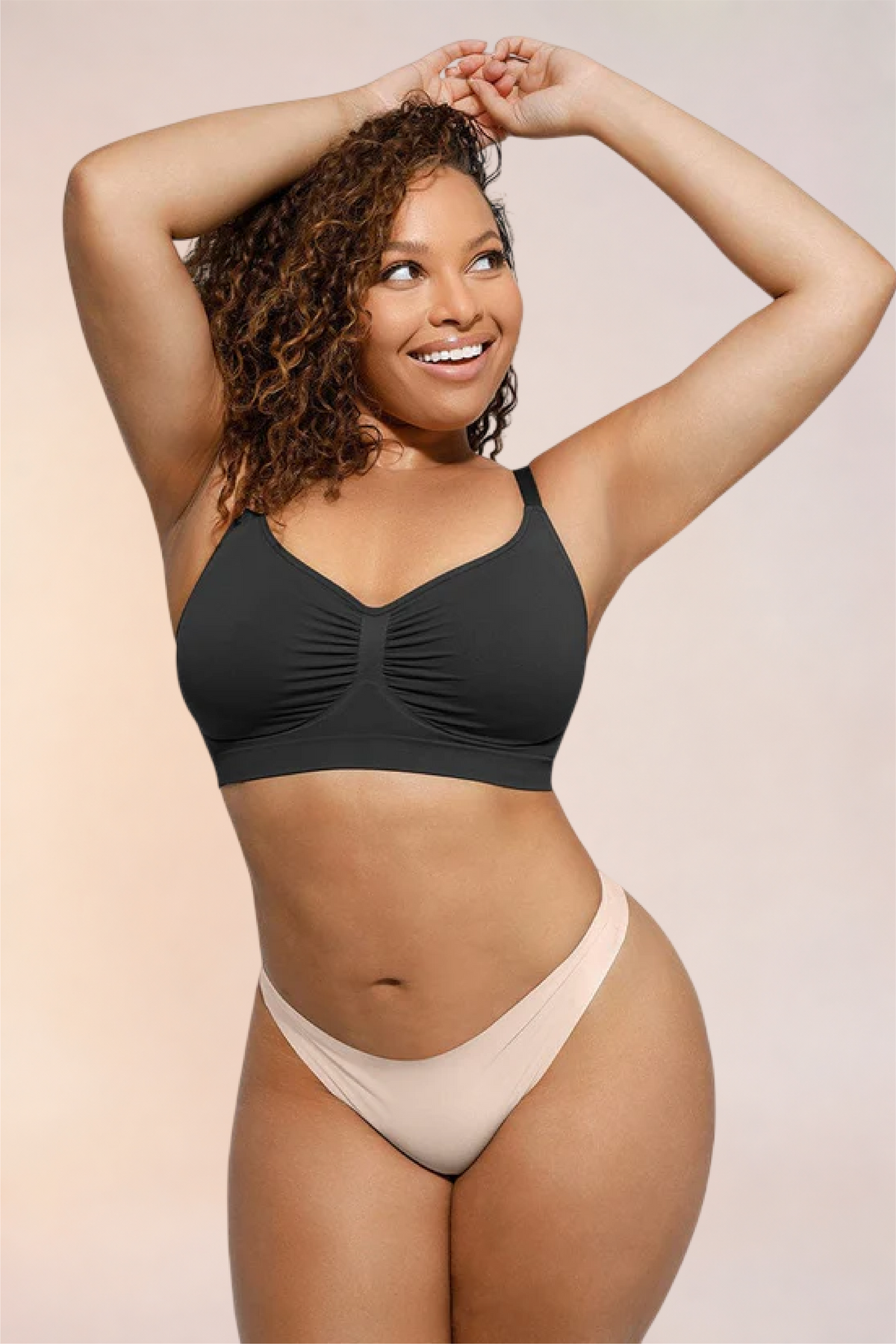 Skinzform Soutien Bra in Noir - half-length front view with arms raised