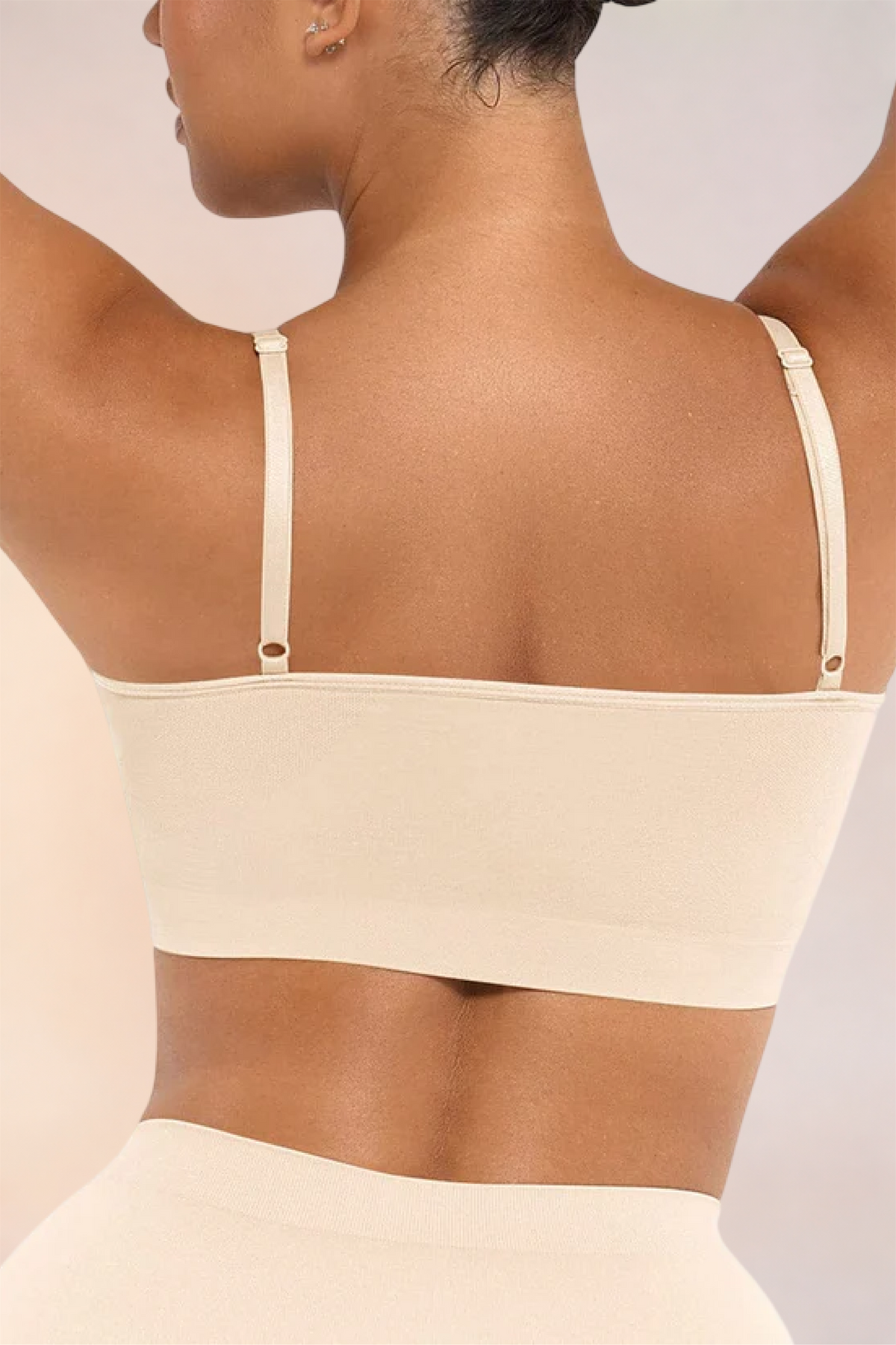 Close-up of the back band and adjustable straps on the Skinzform Soutien Bra in Nude
