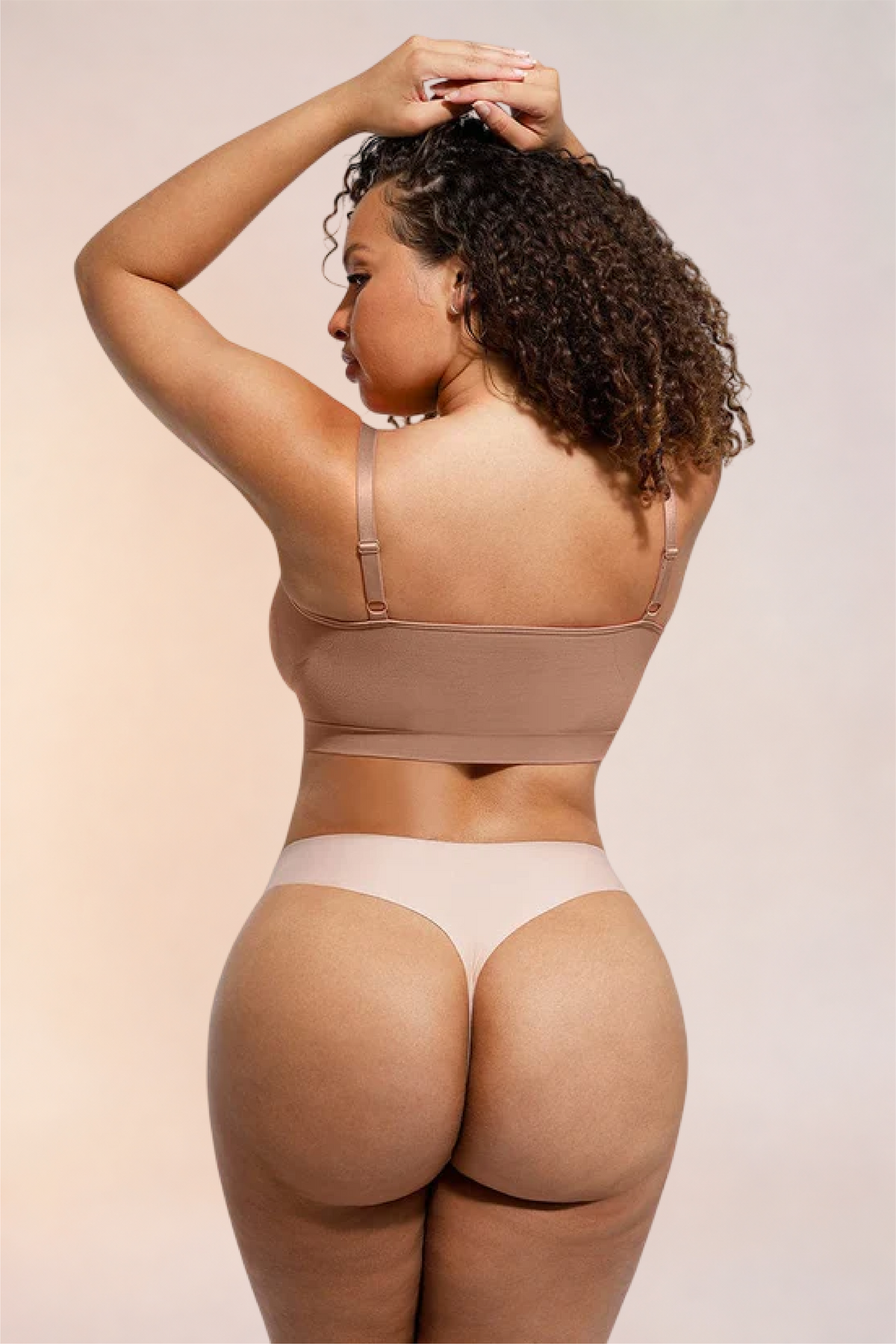 Skinzform Soutien Bra in Tan, back view with arms raised
