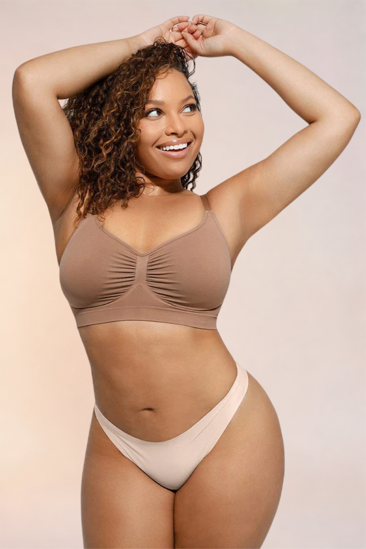 Skinzform Soutien Bra in Tan - half-length front view with arms raised