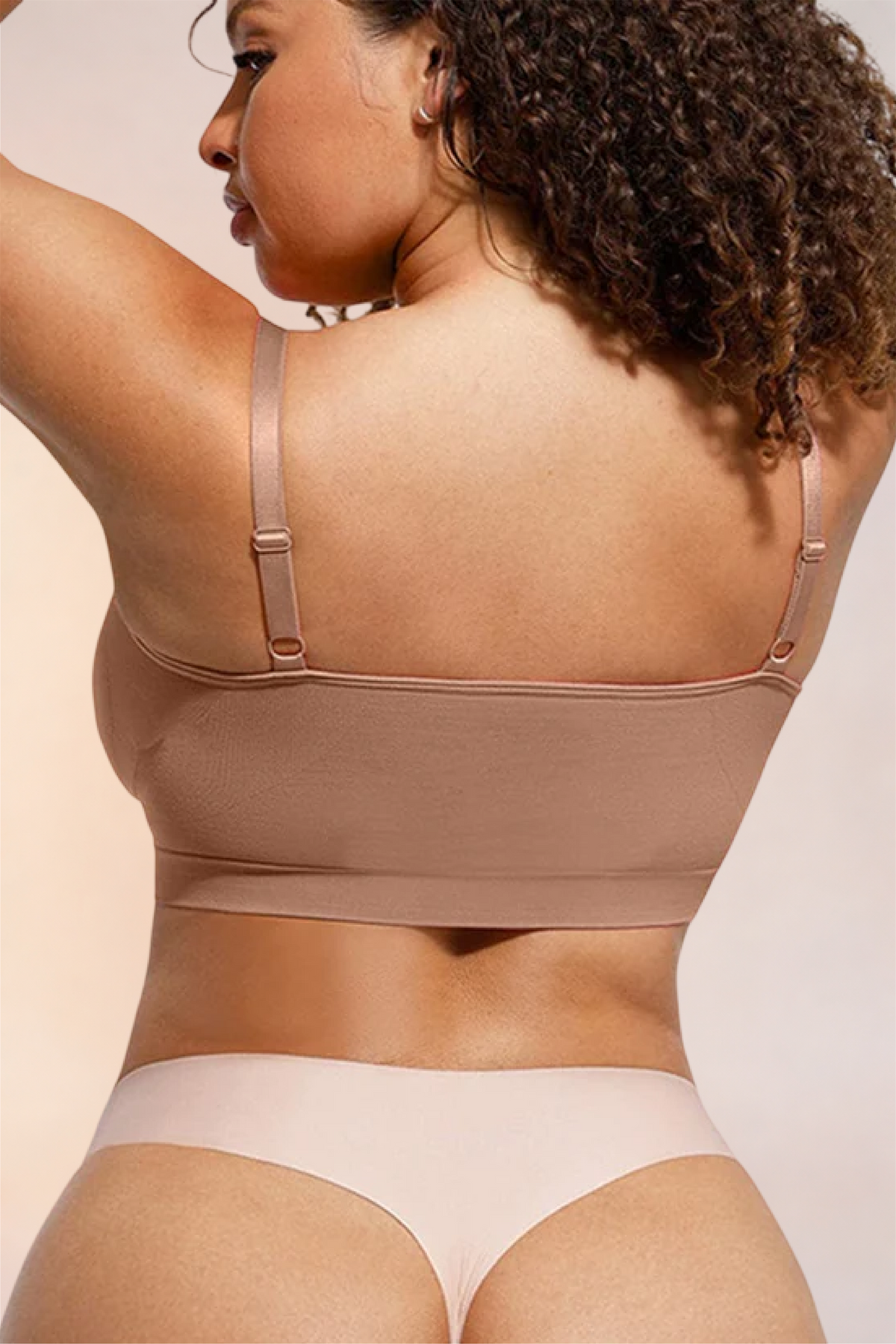 Skinzform Soutien Bra in Tan - model looking back over one shoulder