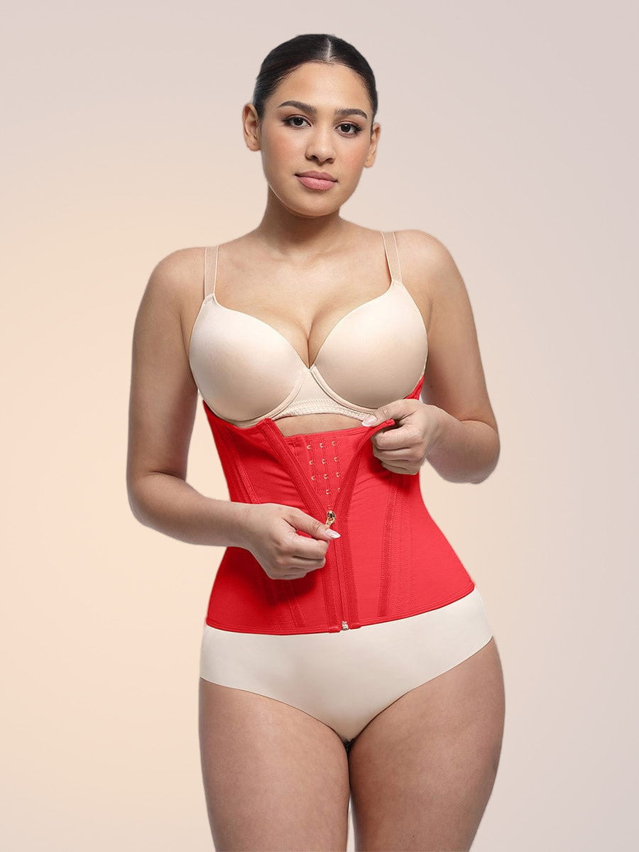 Skinzform Steel Trainer in Rouge - model fastening the front hook-and-eye rows