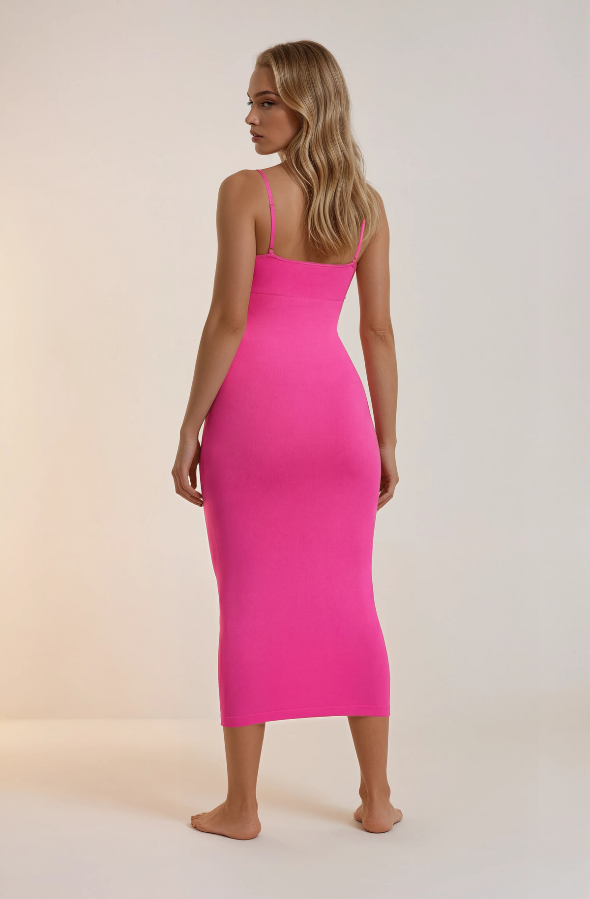 Skinzform Venus Dress in Rose, angled back view on the model