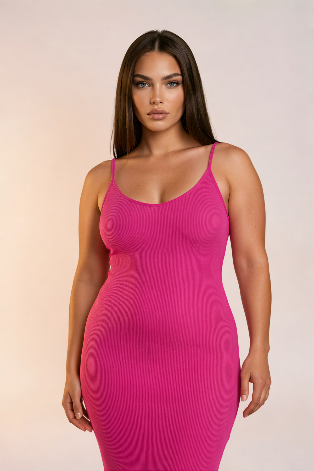 Skinzform Venus Dress in Rose, front view on the model with a hand at the hip